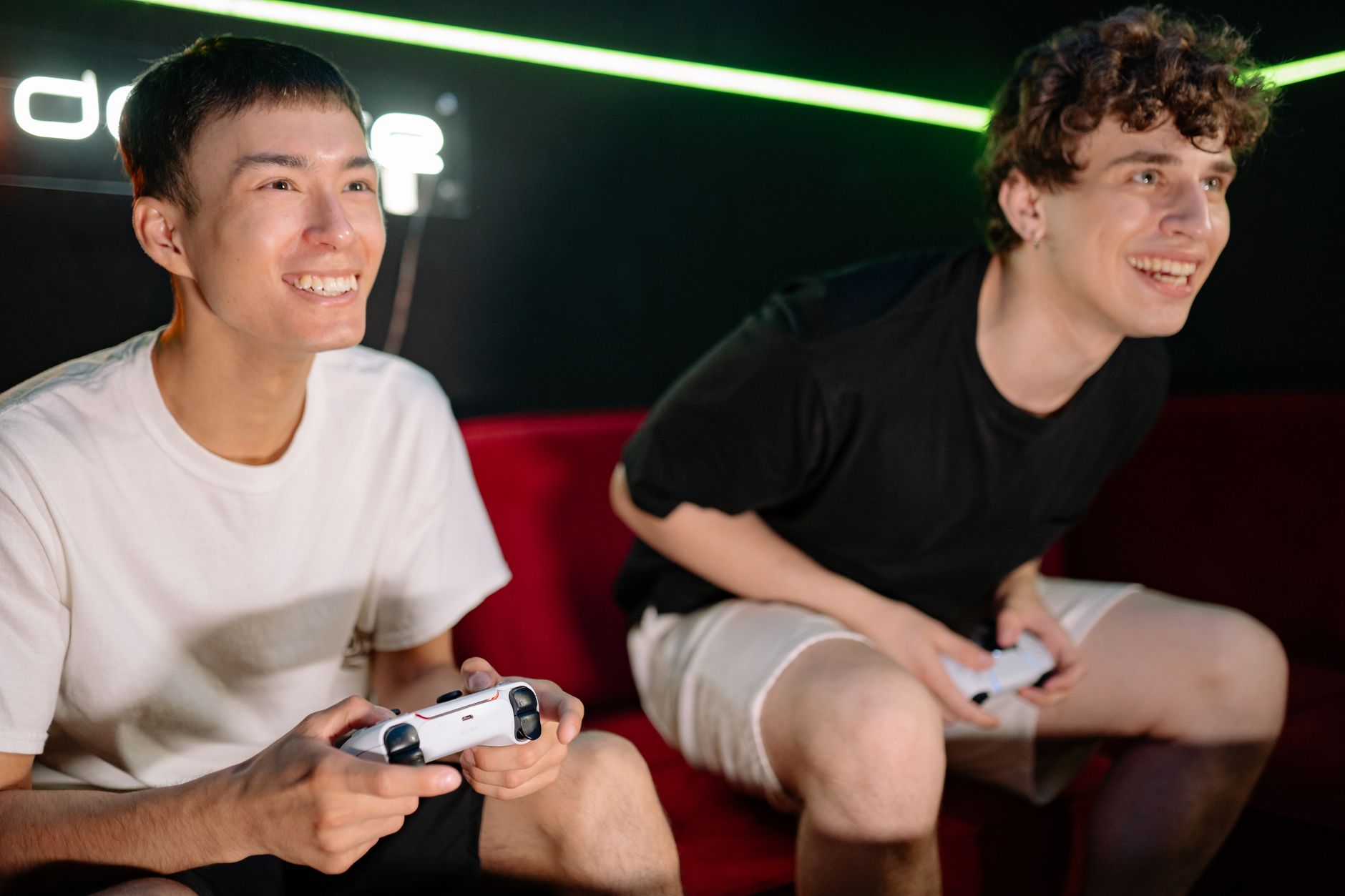 Two friends having fun playing video games indoors, captured in a lively and engaging moment. — Expert Strategies for Buildin